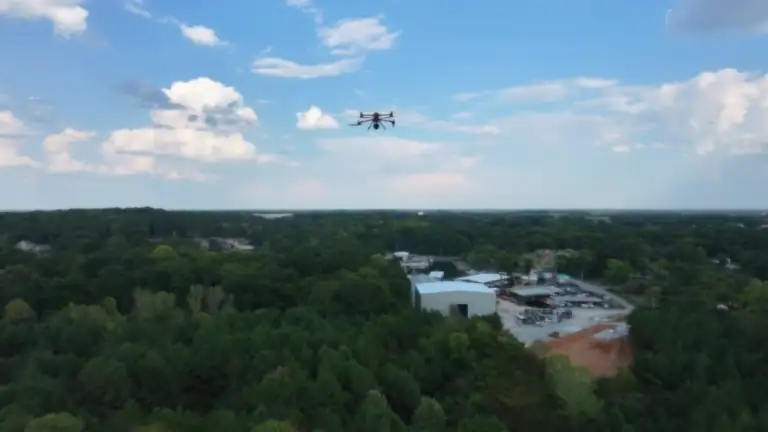 One of our enterprise drones hovering above the treeline